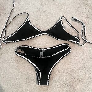 Brand new, never been worn.  Black and white bikini. Size small top and bottom